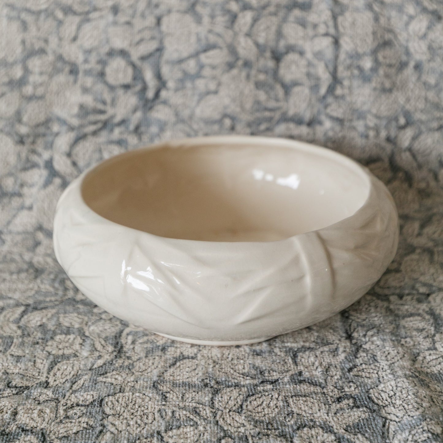White ceramic bowl on a textured gray surface