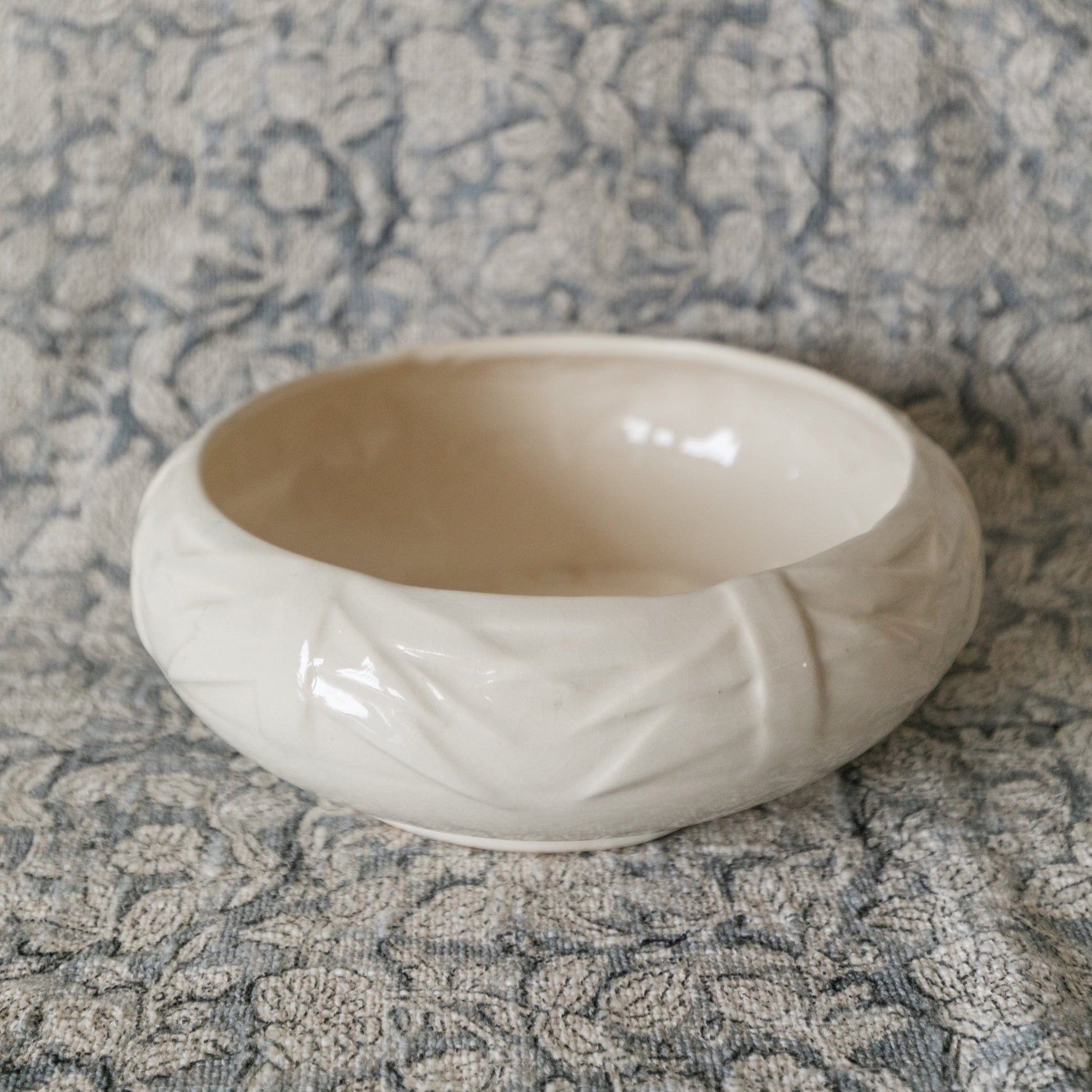 White ceramic bowl on a textured gray surface